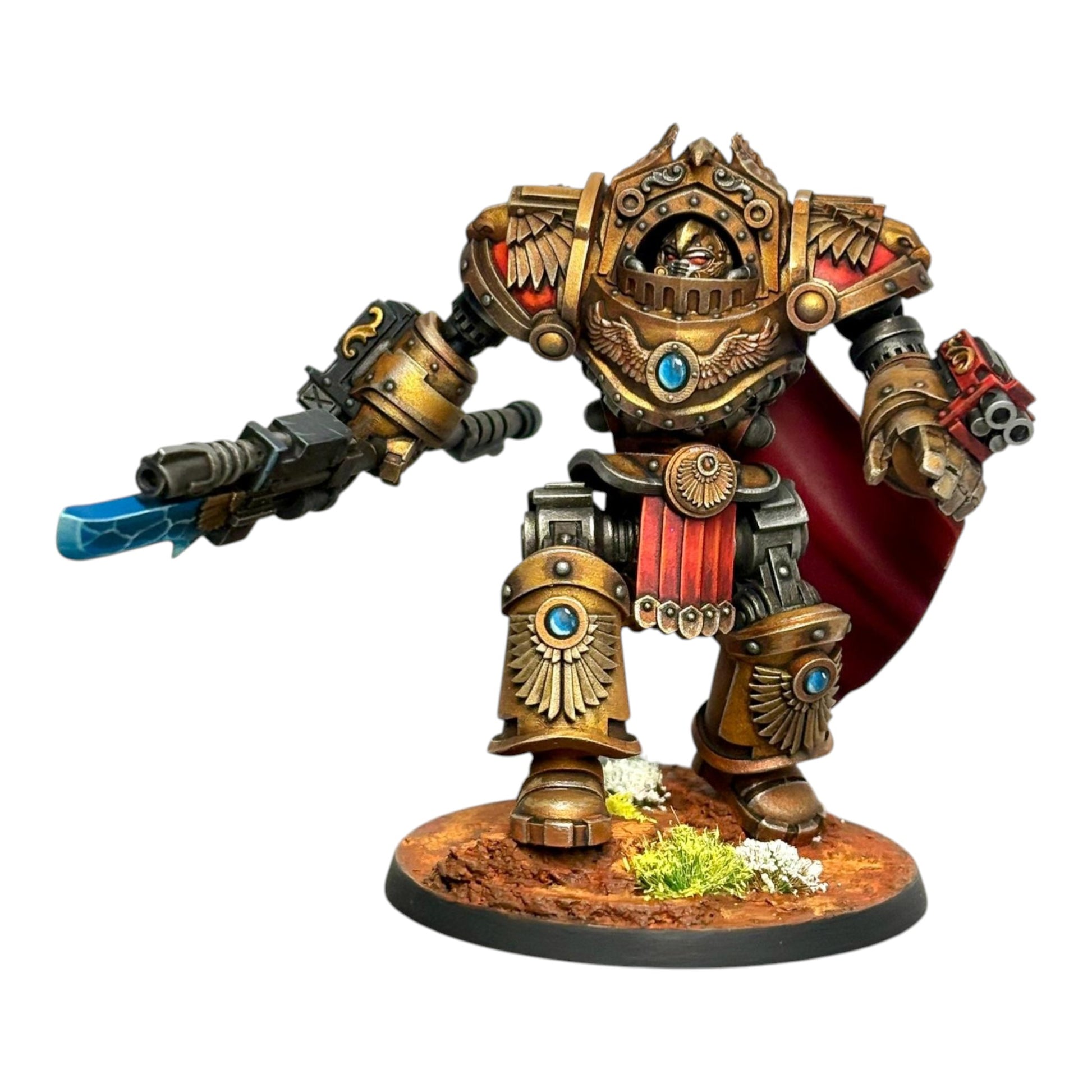 CT Miniatures UK Reliquia Spaciator miniature, a gold-armored sci-fi warrior with red cape, holding a futuristic weapon with blue energy blade.